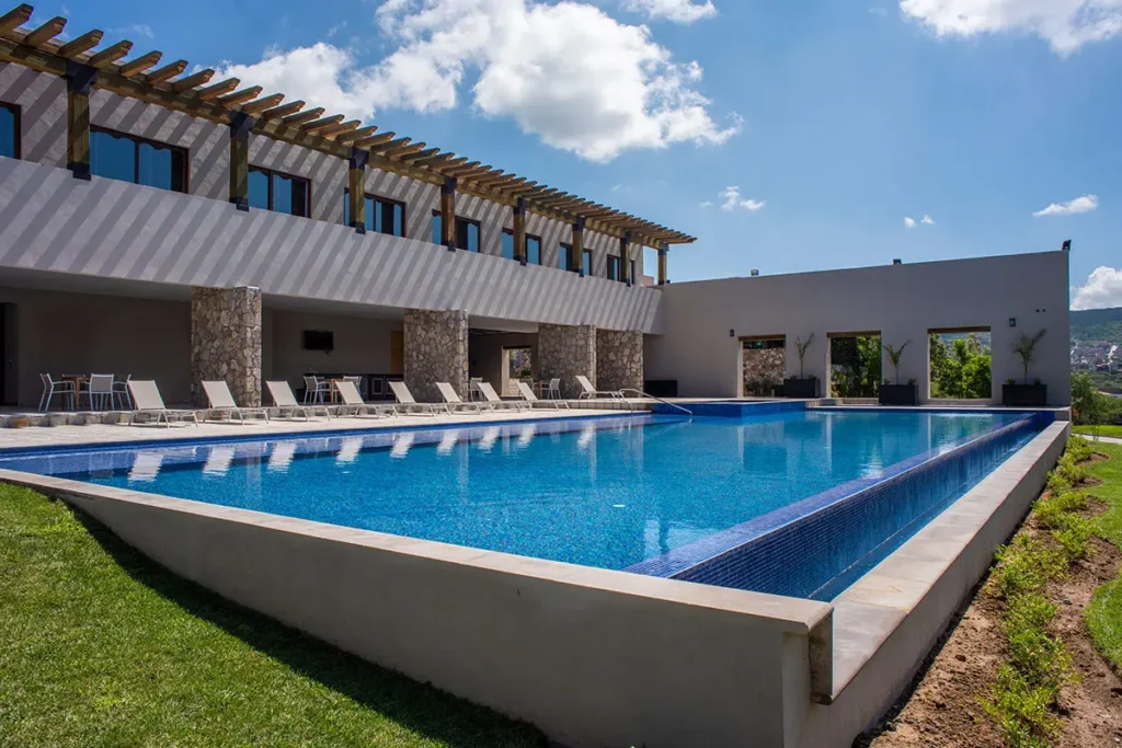 Resort-style community pool and clubhouse at Las Ventanas San Miguel de Allende